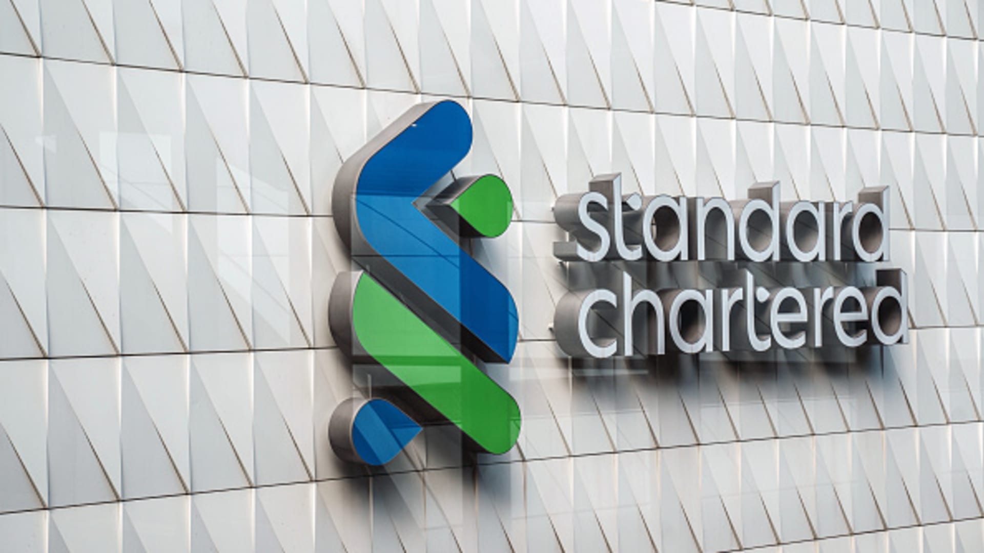 Standard Chartered to cut over 15% of corporate functions roles as it targets higher returns